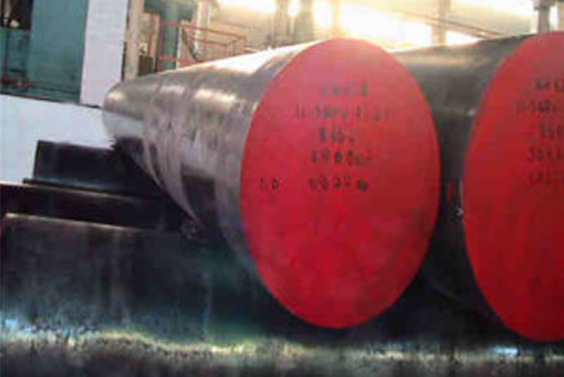 Close-up of a round steel bar with a red-painted end face