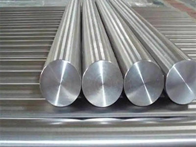Ground steel round bars stacked in parallel, with smooth silver-grey surfaces