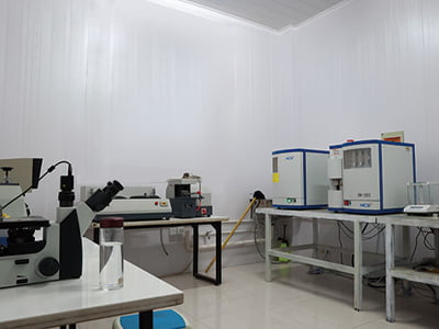 Materials laboratory workbench with several inspection instruments.