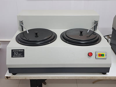 Dual-disc metallographic grinding and polishing machine.