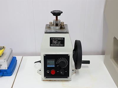 Compact specimen-preparation press or mounting machine.